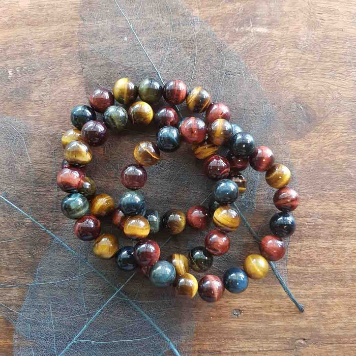 Blue Gold Red Tigers Eye Bracelet (assorted. approx. 12mm round beads)