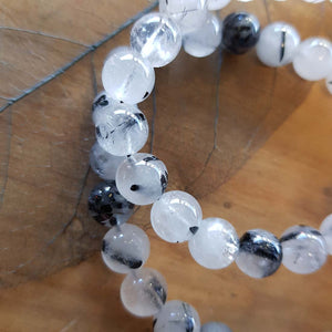 Tourmalinated Quartz Bracelet (assorted. approx. 8mm round beads)