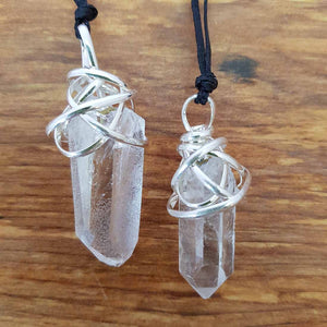 Clear Quartz Point Pendant in Tangle of White Metal