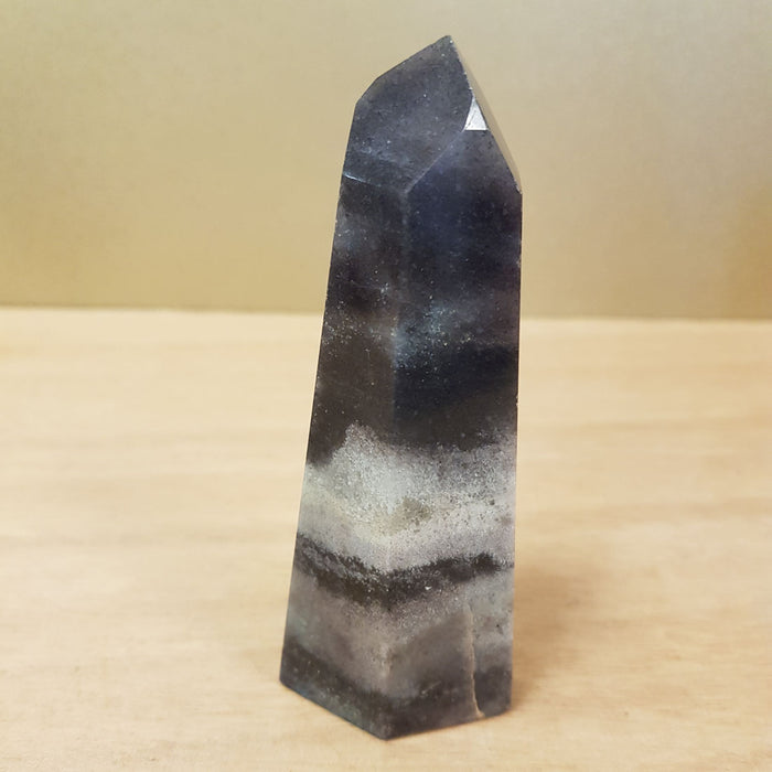 Triallite (aka Trollite) Point. A combination of Lithium, Lepidolite, Blue Tourmaline and Lazulite (approx. 10x4x2.5cm)