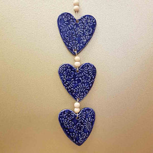 3 Blue Embossed Hearts on a String with Beads. (approx. 38 x 8cm to top of string)