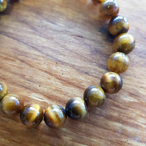 Gold Tigers Eye Bracelet (assorted. approx. 8mm round beads)