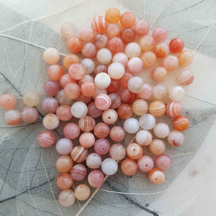Botswana Agate Faceted Bead (assorted. round. approx. 8mm)