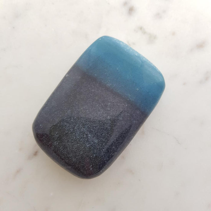 Triallite aka Trollite Palm Stone. A combination of Lithium, Lepidolite, Blue Tourmaline and Lazulite (approx. 7.5x5x2cm)