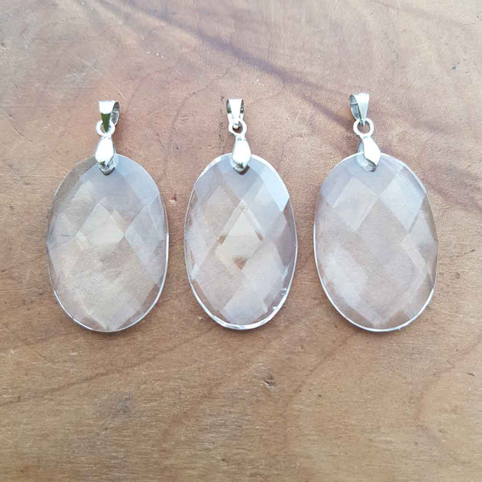 Clear Quartz Faceted Oval Pendant (assorted. silver metal)