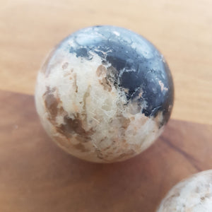 Moonstone with Tourmaline Sphere (assorted. approx. 5.5x5.5cm)