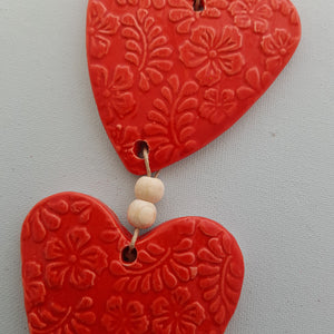 Red Coloured Embossed Hearts 3 on a String with Beads
