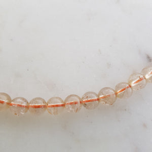 Rutilated Quartz Necklace (approx. 7mm round beads on stretchy thread)