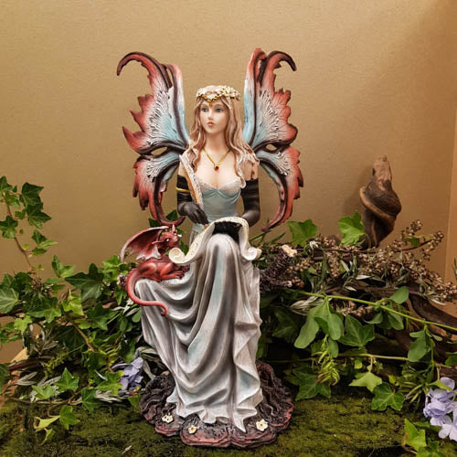 Fairy With Scroll And Dragon Sitting on Tree Trunk (approx 31x14x19cm)