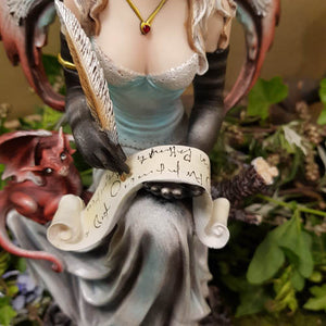 Fairy With Scroll And Dragon Sitting on Tree Trunk