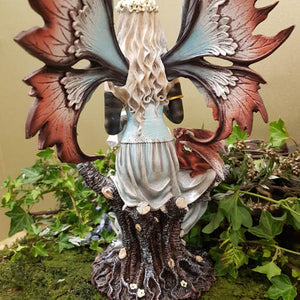 Fairy With Scroll And Dragon Sitting on Tree Trunk