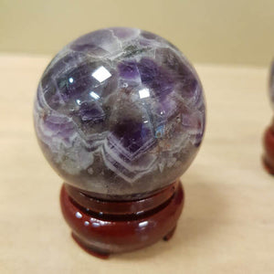 Chevron Amethyst Sphere with Wooden Stand (assorted. approx. 4.7cm diameter)