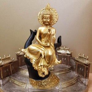 Gold Thai Buddha Sitting in Black Hand (approx. 24x13cm)