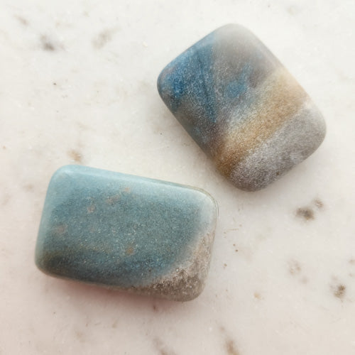 Triallite (aka Trollite) Palm Stone. A combination of Lithium, Lepidolite, Blue Tourmaline and Lazulite (approx. 5.5x3.5cm)