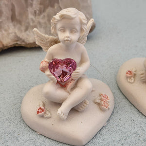 Cherub Holding Pink Gem Heart