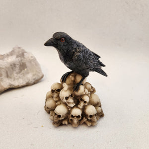 Crow Standing on Skulls Ornament