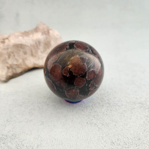 Astrophyllite with Garnet Sphere (approx. 5.5cm diameter)