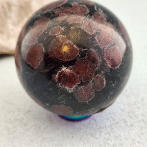 Astrophyllite with Garnet Sphere