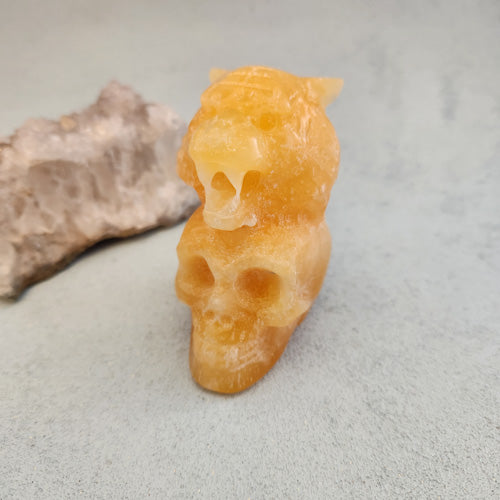 Orange Calcite Tiger on Skull (approx. 8x6x4cm)