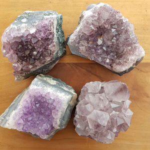 Small bright Amethyst clusters with defined purple points and natural shine.