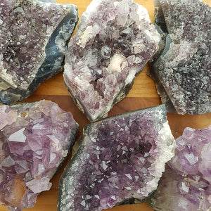 Medium Amethyst clusters with various purple points and bright natural shimmer.