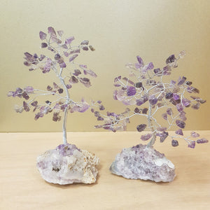 Amethyst chip‑leaf crystal tree on a quartz and amethyst base.