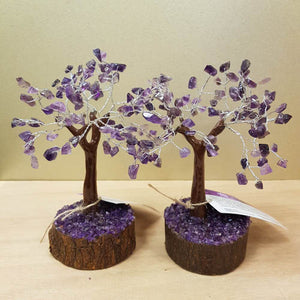 Amethyst chip stone tree displayed on a natural neem wood base