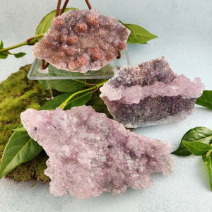 Flat amethyst druzy plate with sparkling purple crystal surface.