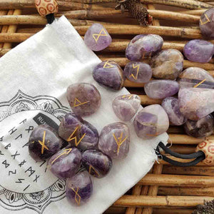 Set of amethyst rune stones with carved symbols and mixed tones