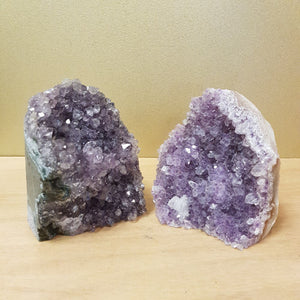 Large standing Amethyst clusters with small purple points and natural shimmer.