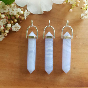 Blue Lace Agate point pendant with soft blue banding set in a silver plated bail