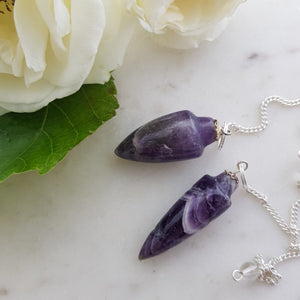 Chevron amethyst drop pendulum showing purple and white banding.