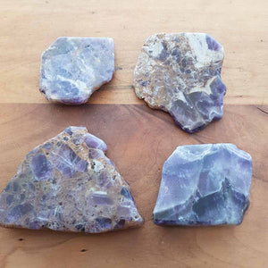 Chevron amethyst polished slab showing natural purple and white banding.