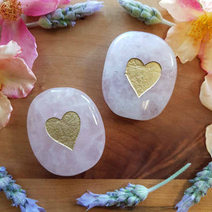 Polished rose quartz gold heart flat stone with soft pink colour.